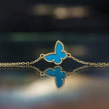 [LUXE] TÜRKIS-SCHMETTERLINGSARMBAND MIT SCHMETTERLINGS-MOTIVEN